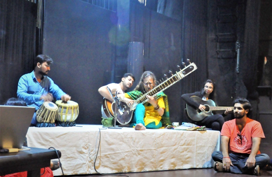 Amie presents workshop on performing world music with Waqas Gulab (L) on tabla and other NAPA students. National Academy for Performing Arts, Karachi, Aug. 2018