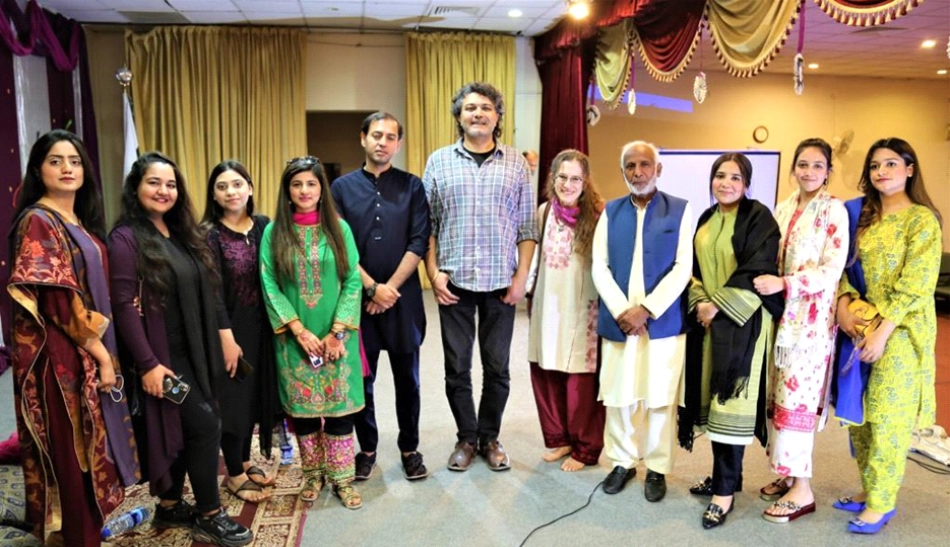 FJWU faculty (4th from L - Prof. Shafia Azam, Prof. Muhammad Bilal) with Amie and other performers (center of group - Arieb Azhar, R of Amie - Javad Khan), following inaugural presentation/performance of Indigenous Performance Traditions series. Rawalpindi, Feb. 2023