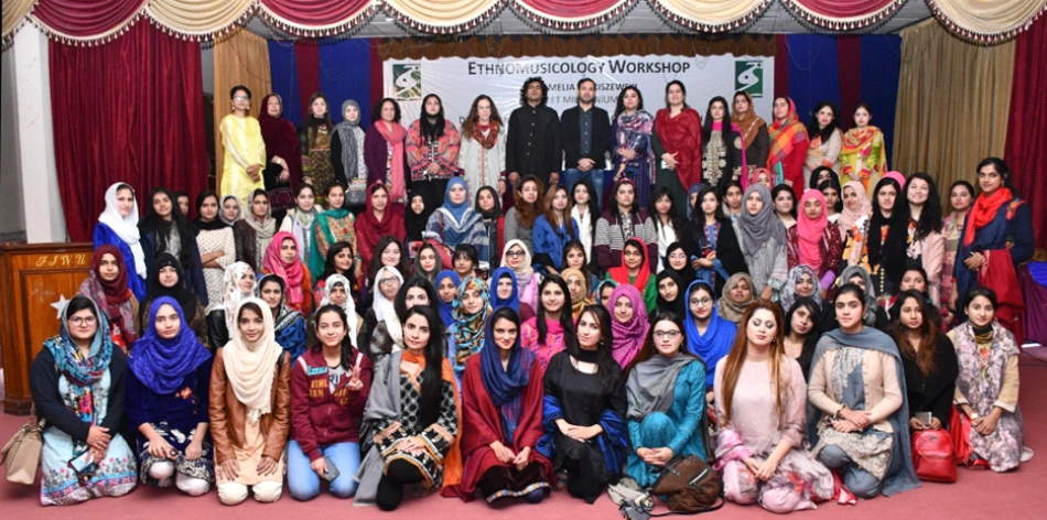 Group photo including faculty, students, and artists (Amie and the late Sejawat Khan, rear center) at Ethnomusicology Workshop presented by Fatima Jinnah Women’s University Departments of Anthropology, Urdu, and Fine Arts, Rawalpindi, Dec. 2019