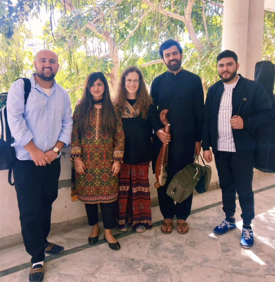 Jiill Ensemble at FJWU Dept. following their lecture-demonstration on Hareep music of Hunza. L-R: Arsalan Haider (percussion - dadang, damaal), Prof. Dr. Shafia Azam (Anthropology, co-host), Amie, Mujeeb Ruzik (xighini, rabab), Masood Haraking (Chitrali setar). March 2023